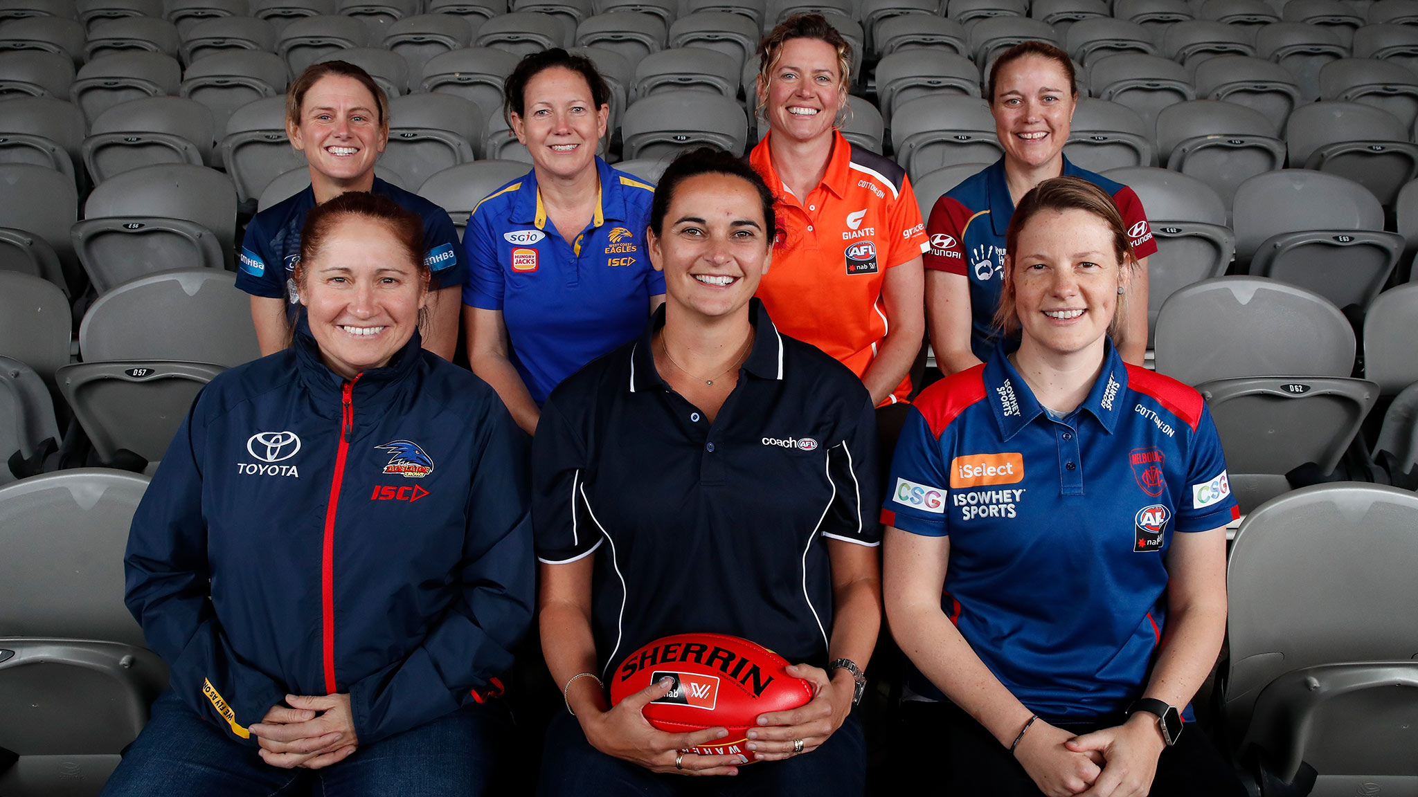 AFLWcoaches300x300.jpg Michelle Cowan (centre) with the six Academy Coaches - AFLW